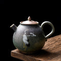 Round Japanese teapot with cranes