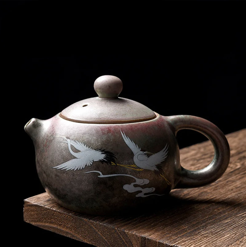 Round Japanese teapot with cranes