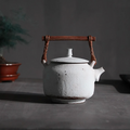 White hand-made Japanese teapot