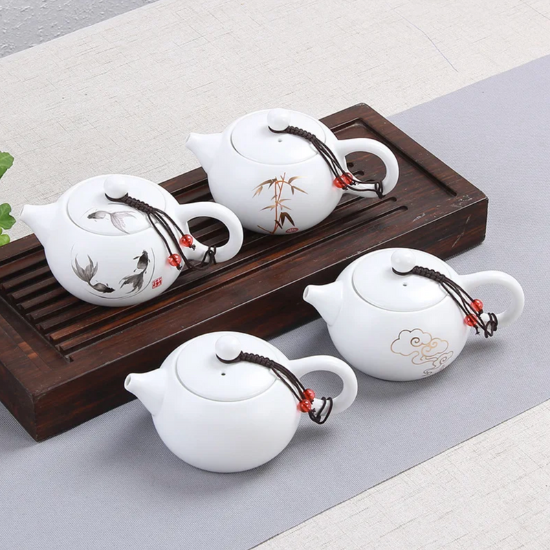 Small white Japanese teapot with drawing