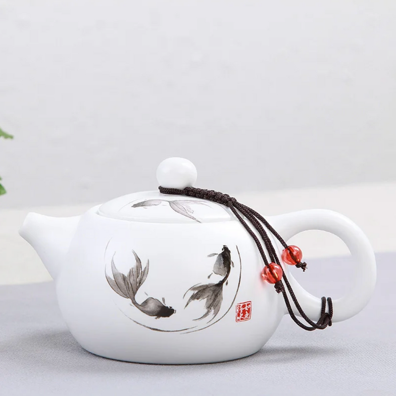 Small white Japanese teapot with drawing