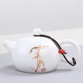 Small white Japanese teapot with drawing