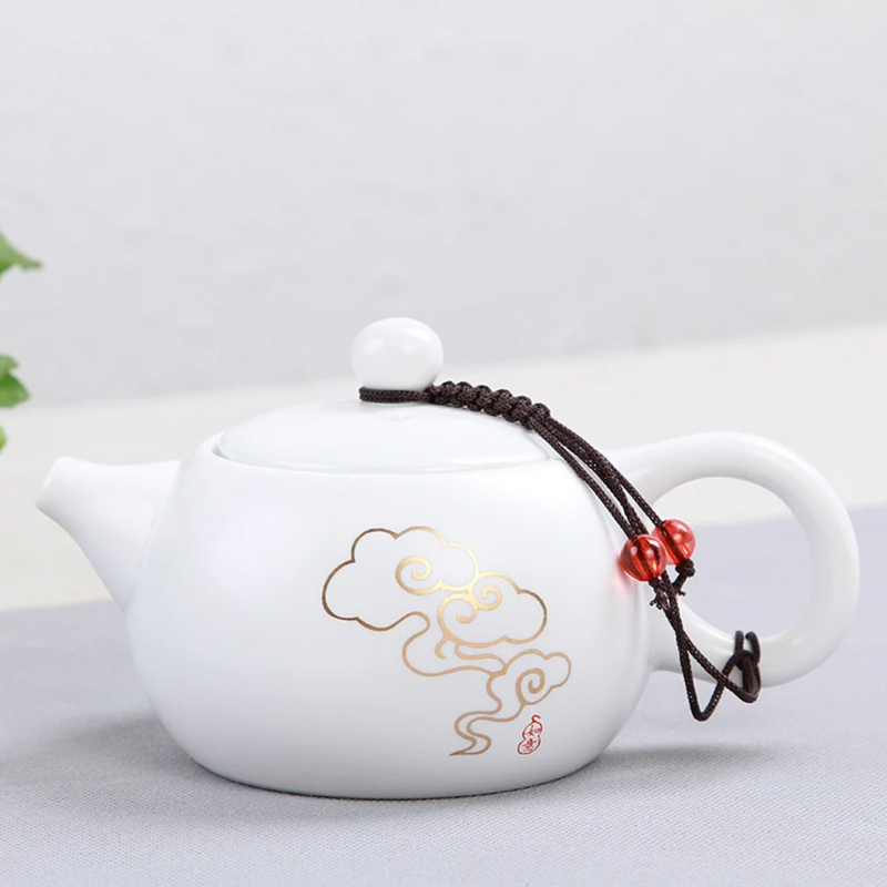 Small white Japanese teapot with drawing